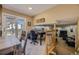 Open dining area features adjacent office and stairway with natural light from sliding doors at 4593 S Field St, Littleton, CO 80123