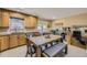 Bright kitchen and dining area with stainless steel appliances and natural light from sliding doors at 4593 S Field St, Littleton, CO 80123