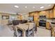 Open kitchen and living area with stainless steel appliances perfect for modern living at 4593 S Field St, Littleton, CO 80123