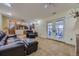 The living room includes comfortable leather seating, french doors, and an attached workout room at 4593 S Field St, Littleton, CO 80123