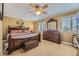 Comfortable main bedroom with ceiling fan, plantation shutters, and classic wood furniture at 4593 S Field St, Littleton, CO 80123
