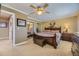 Comfortable main bedroom with ceiling fan, and mirrored closet doors at 4593 S Field St, Littleton, CO 80123