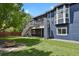 Expansive backyard with a wooden deck and staircase, perfect for outdoor entertaining and relaxation at 2485 Vale Way, Erie, CO 80516