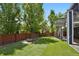 Lush backyard featuring a custom fire pit and mature trees, creating a serene outdoor oasis at 2485 Vale Way, Erie, CO 80516