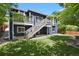 Spacious backyard features an upper deck with stairs leading to the lush, green lawn at 2485 Vale Way, Erie, CO 80516