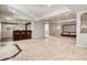 Large finished basement features bar, home theater, carpet and tile floors at 2485 Vale Way, Erie, CO 80516