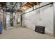 Unfinished basement with utilities including a furnace and water heater at 2485 Vale Way, Erie, CO 80516