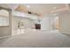 Open basement with tile and carpet, bar stools, and french doors to outside at 2485 Vale Way, Erie, CO 80516