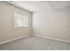 Neutral bedroom with a carpeted floor and white trim window with window blinds at 2485 Vale Way, Erie, CO 80516