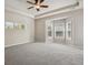 Bright bedroom featuring neutral paint, carpeted floors, and a ceiling fan at 2485 Vale Way, Erie, CO 80516