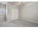 Neutral bedroom featuring wall to wall carpet, window and large closet at 2485 Vale Way, Erie, CO 80516