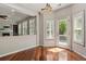 Bright dining area with wood floors, natural light, and easy access to balcony at 2485 Vale Way, Erie, CO 80516