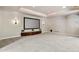 Basement Home Theater with large screen, pot lights, carpet, and storage at 2485 Vale Way, Erie, CO 80516