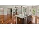 Gourmet kitchen with stainless steel appliances, a granite island, and an open view to the living area at 2485 Vale Way, Erie, CO 80516