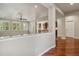 Bright living room featuring hardwood floors, natural light, and open floor plan to kitchen and adjacent rooms at 2485 Vale Way, Erie, CO 80516