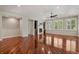 Open living room with hardwood floors, fireplace, built-ins, and abundant natural light at 2485 Vale Way, Erie, CO 80516