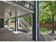 Covered patio area with ceiling fan and staircase leading up to the deck, perfect for outdoor living at 2485 Vale Way, Erie, CO 80516