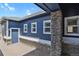 Side view showcasing the home's attractive facade, multiple windows, and convenient side entrance at 2485 Vale Way, Erie, CO 80516