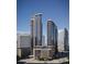 Modern high-rise condominium buildings featuring sleek design and expansive glass windows against a clear blue sky at 525 18Th St # 905, Denver, CO 80202