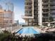 Rooftop pool with lounge chairs offers scenic city views and outdoor relaxation at 525 18Th St # 905, Denver, CO 80202