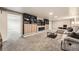 Finished basement with plush carpeting, custom built-ins surrounding a fireplace, and a comfortable seating area at 1819 S Nile Ct, Aurora, CO 80012