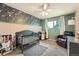 Charming Bedroom with a green crib, patterned wallpaper, and a cozy armchair at 1819 S Nile Ct, Aurora, CO 80012