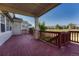 Spacious back deck perfect for entertaining with railing and stone pillar details at 8107 S Catawba Ct, Aurora, CO 80016