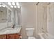 Bathroom featuring a vanity with granite counters, a shower, and a toilet at 8107 S Catawba Ct, Aurora, CO 80016