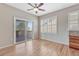 Cozy dining area boasts sliding glass doors to a wooden deck, complemented by bright windows at 8107 S Catawba Ct, Aurora, CO 80016