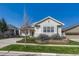 Well-maintained home with manicured lawn and brick-lined flower beds at 8107 S Catawba Ct, Aurora, CO 80016