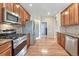 The kitchen features stainless steel appliances, granite countertops, and ample cabinet space for storage at 8107 S Catawba Ct, Aurora, CO 80016