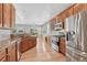 Spacious kitchen with granite countertops, stainless steel appliances, and hardwood floors at 8107 S Catawba Ct, Aurora, CO 80016