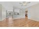 Spacious living room with hardwood floors and archway into kitchen area at 8107 S Catawba Ct, Aurora, CO 80016