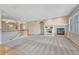 Bright and spacious living room with a cozy fireplace and neutral carpeting at 8107 S Catawba Ct, Aurora, CO 80016