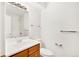 Bathroom with wood vanity, toilet, and shower/tub combo at 13651 E Yale Ave # C, Aurora, CO 80014