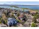 An aerial view of a home and its neighborhood near a blue lake at 6266 W Prentice Ave, Littleton, CO 80123