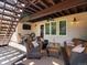 Relax on this covered patio with comfortable seating and outdoor television, ideal for unwinding outdoors at 6266 W Prentice Ave, Littleton, CO 80123