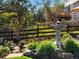 A tranquil backyard features a stone fountain and lush garden, creating a serene and picturesque outdoor oasis at 6266 W Prentice Ave, Littleton, CO 80123
