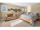 Bright bedroom features a comfortable bed, couch, and plenty of sunlight streaming through the windows at 6266 W Prentice Ave, Littleton, CO 80123