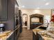 Elegant kitchen features granite counters, gray cabinetry, and stainless steel appliances at 6266 W Prentice Ave, Littleton, CO 80123