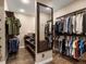 Spacious walk-in closet with custom shelving and hanging racks for optimal organization and wardrobe storage at 6266 W Prentice Ave, Littleton, CO 80123