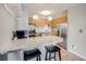 Kitchen featuring stainless steel appliances, modern lighting, and counter seating at 2575 S Syracuse Way # K201, Denver, CO 80231