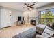 Inviting living room with a fireplace, balcony access, and modern furnishings at 2575 S Syracuse Way # K201, Denver, CO 80231