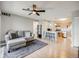 Open living space featuring a comfortable sofa, and a kitchen with counter seating at 2575 S Syracuse Way # K201, Denver, CO 80231