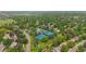 Beautiful aerial view of a neighborhood with mature trees, tennis courts, and a community pool at 6839 S Niagara Ct, Centennial, CO 80112