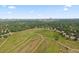 Scenic aerial view featuring a green space with paths and a distant skyline at 6839 S Niagara Ct, Centennial, CO 80112