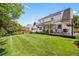 Expansive backyard featuring a well-manicured lawn, spacious deck area, and shade structure at 6839 S Niagara Ct, Centennial, CO 80112