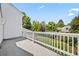 Outdoor balcony space with white railings overlooking a well-maintained yard at 6839 S Niagara Ct, Centennial, CO 80112