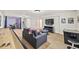 Spacious basement featuring a games area, entertainment center, and a lounge area with modern decor at 6839 S Niagara Ct, Centennial, CO 80112