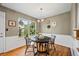 Charming dining room with natural light, stylish decor, and hardwood flooring at 6839 S Niagara Ct, Centennial, CO 80112